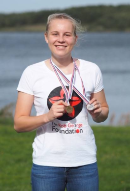 RGF Grantee Miriam showing medals