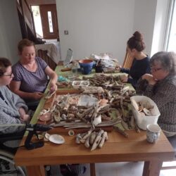 Amy and family making driftwood mirror
