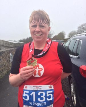 Rachel Driver with running medal
