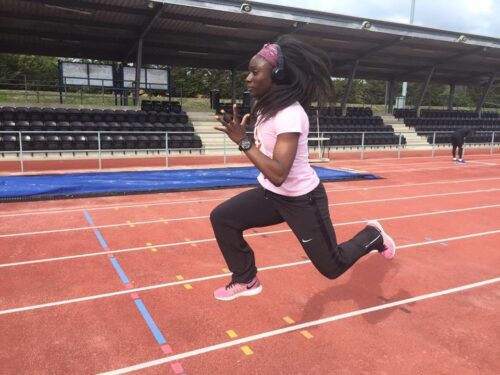 Leanza sprinting on running track
