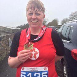 Rachel Driver with running medal