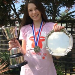 Heaven with her swimming trophies and medals