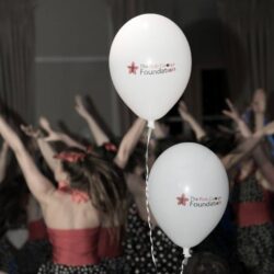 RGF balloons in a crowded room