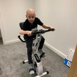 Jude using exercise bike