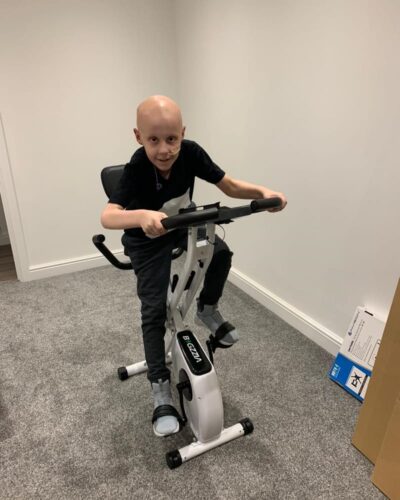 Jude using exercise bike